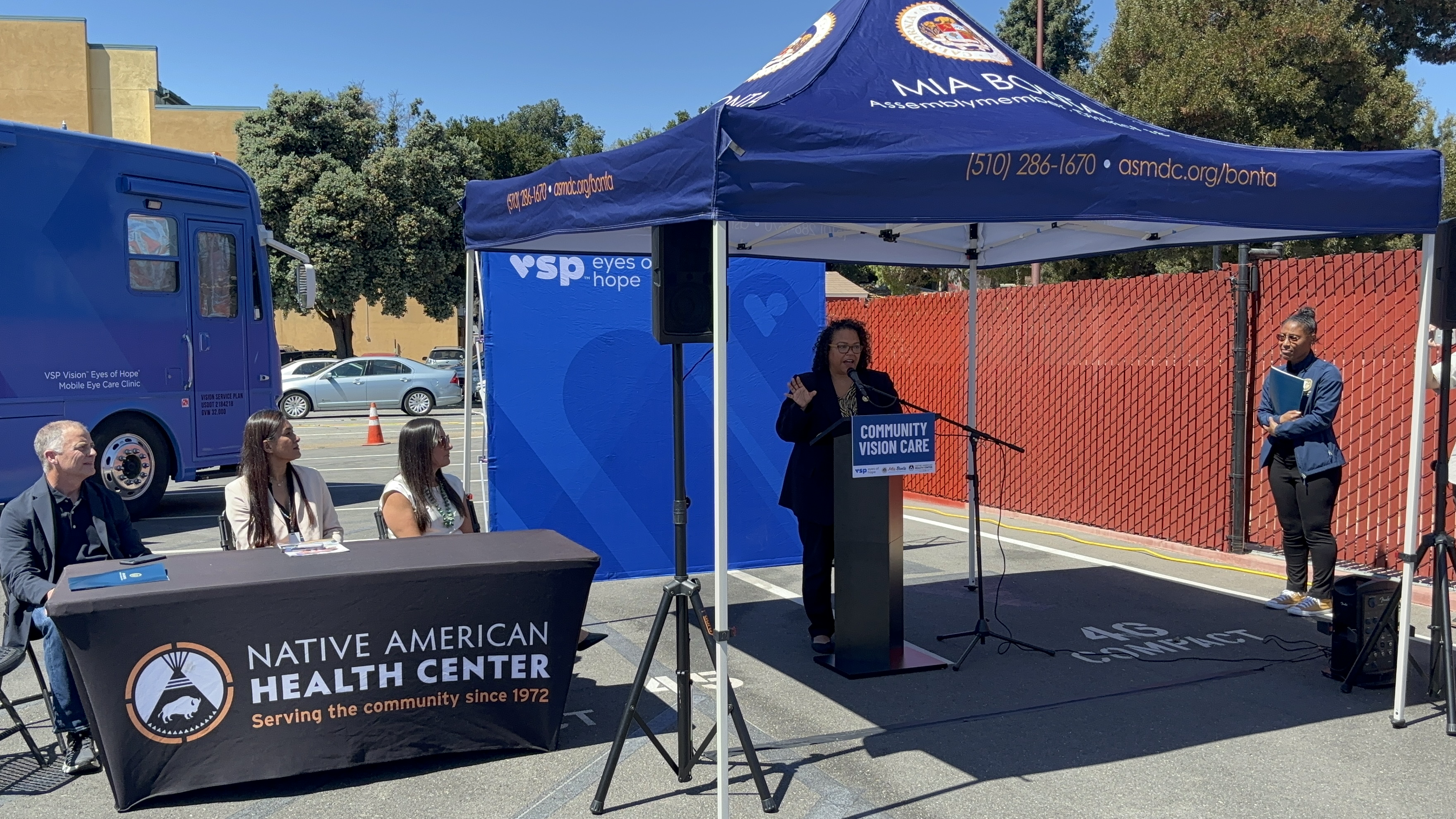 Assemblymember Mia Bonta speaks at a podium at her Community Vision Care Press Conference.