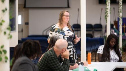 Photo of guest speaking LGBTQ Roundtable