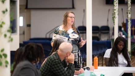 Photo of guest speaking LGBTQ Roundtable